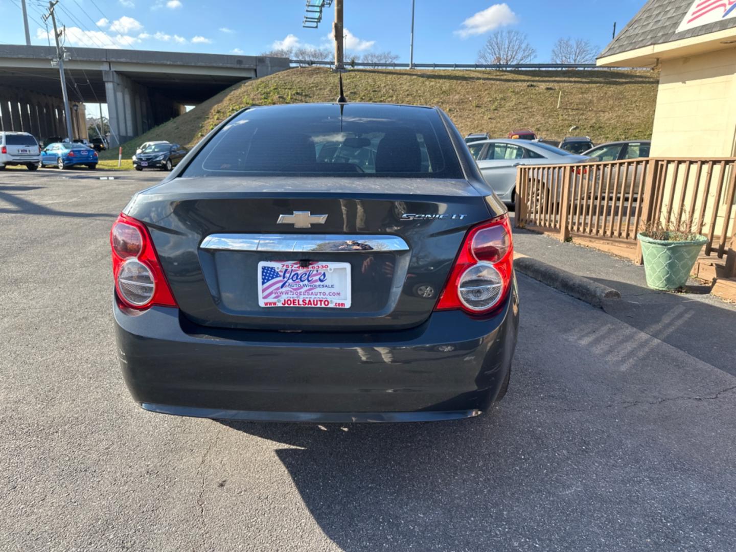 2014 Gray Chevrolet Sonic (1G1JC5SHXE4) , located at 5700 Curlew Drive, Norfolk, VA, 23502, (757) 455-6330, 36.841885, -76.209412 - Photo#4